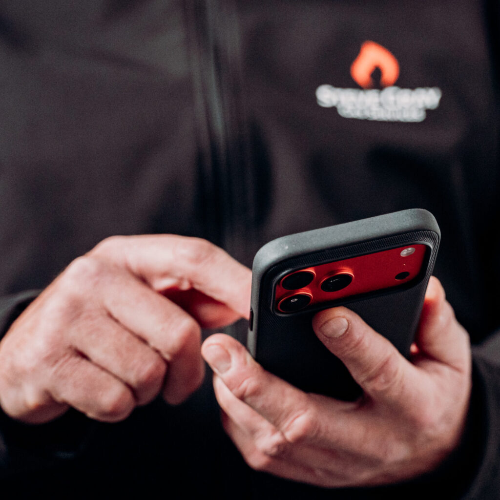 tradesperson using powered now job management software